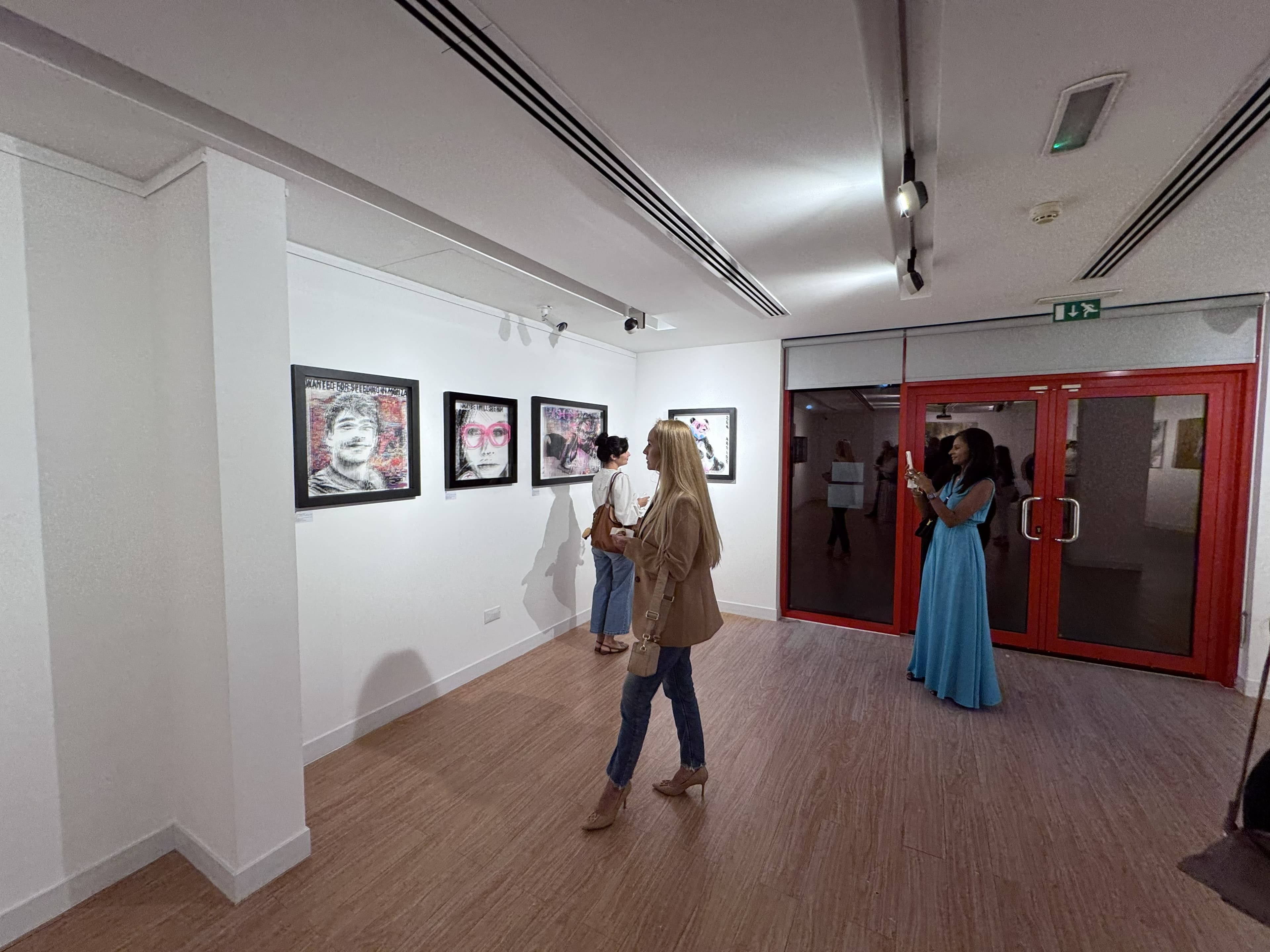Visitors viewing Fabian PhiL artworks at Alliance Française Dubai